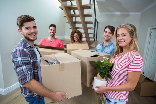 Professional movers handling furniture in Hackney Marshes