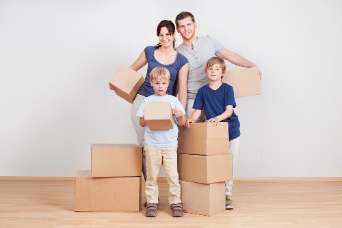 Professional movers loading a van