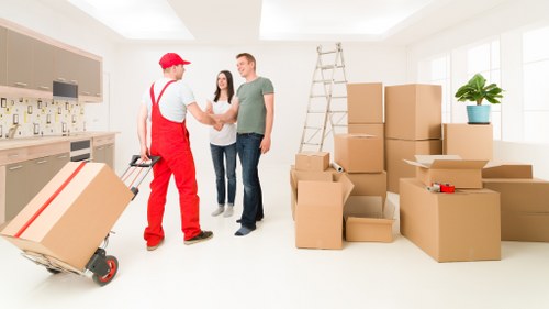 Professional movers handling furniture with care