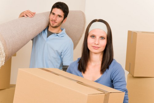 Professional movers handling furniture in a home move