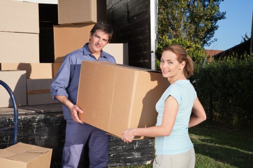 Team packing items into a removal van